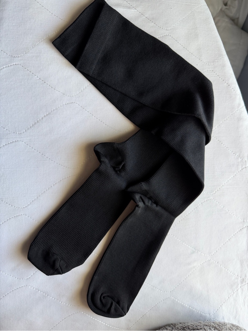 Black over-the-knee or thigh-high ribbed socks/
